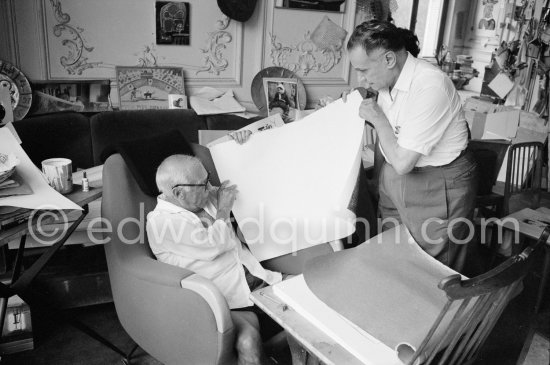 Pablo Picasso and Henri Matarasso, gallery owner and publisher, checking the etching "La Minotauromachie". La Californie, Cannes 1961. - Photo by Edward Quinn