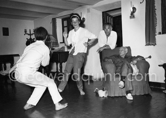 Pablo Picasso and painter André Verdet watching Catherine Hutin and Claude Picasso dancing the Twist in a restaurant at Mougins 1962. - Photo by Edward Quinn