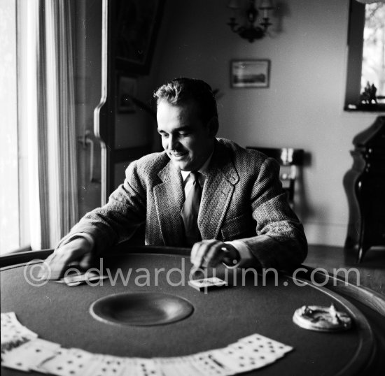 Prince Rainier of Monaco playing cards at Villa Iberia, Saint-Jean-Cap-Ferrat 1954. - Photo by Edward Quinn