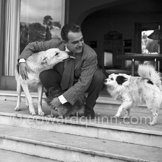 Prince Rainier of Monaco at the time he was still "the bachelor prince". Here he is in his bachelor hide-out, Villa Iberia, with his dogs Bella, John and Whiskey. Saint-Jean-Cap-Ferrat 1954. - Photo by Edward Quinn
