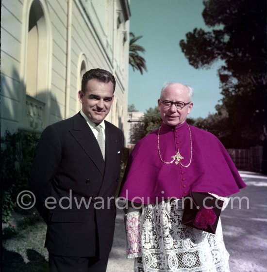 Prince Rainier and Father Tucker, known as the "troubadour du Bon Dieu". He was the chaplain for the Palace of Monaco and gray eminence of Prince Rainier, he was also chanoine of St. Roman. In the gardens of the Palace of Monaco 1954. - Photo by Edward Quinn
