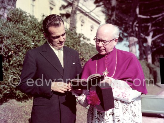 Prince Rainier and Father Tucker, known as the "troubadour du Bon Dieu". He was the chaplain for the Palace of Monaco and gray eminence of Prince Rainier, he was also chanoine of St. Roman. In the gardens of the Palace of Monaco 1954. - Photo by Edward Quinn