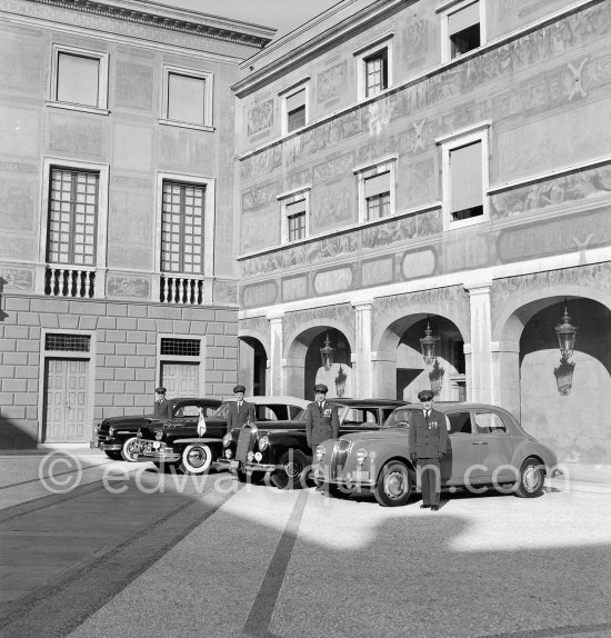 The cars and chauffeurs of Prince Rainier in the court of the Palace. Monaco-Ville 1954. From left:1953 Ford Vedette (Mr. Louche), 1950 Lincoln Cosmopolitan (Mr.Benoit), Mercedes-Benz 300 Limousine (Mr. Raimondo) and Lancia Aurelia B10 Berlina or B21 (RHD) (Mr. Pogliano). - Photo by Edward Quinn