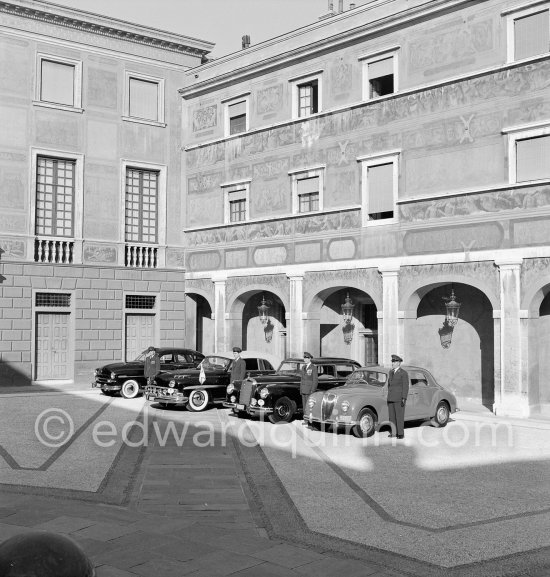 The cars and chauffeurs of Prince Rainier in the court of the Palace. Monaco-Ville 1954. From left: 1953 Ford Vedette (Mr. Louche), 1950 Lincoln Cosmopolitan (Mr.Benoit), Mercedes-Benz 300 Limousine (Mr. Raimondo) and Lancia Aurelia B10 Berlina or B21 (RHD) (Mr. Pogliano). - Photo by Edward Quinn