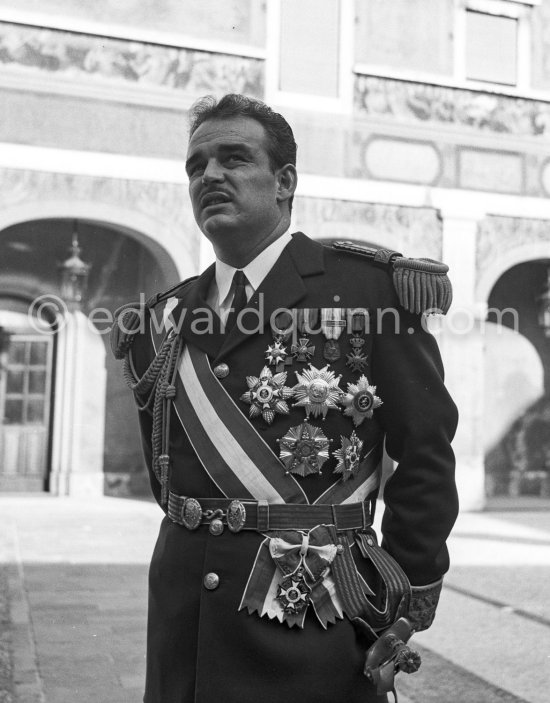 Prince Rainier in the courtyard of the palace. Fête Nationale, Monaco 1954. - Photo by Edward Quinn