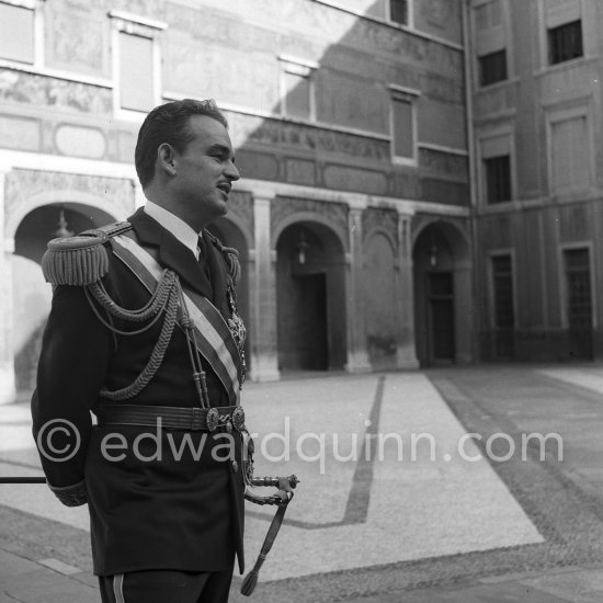 Prince Rainier in the courtyard of the palace. Fête Nationale, Monaco 1954. - Photo by Edward Quinn
