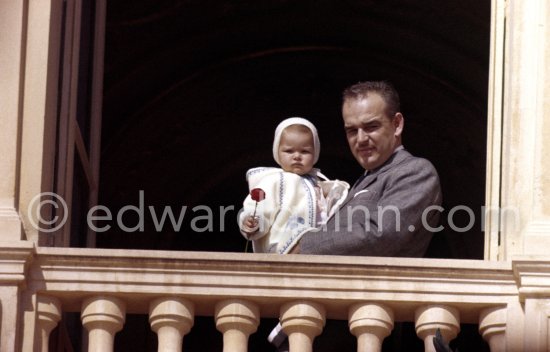 Prince Rainier of Monaco with Princess Caroline at the Palace window, on the day of the Baptism of Prince Albert, in Monaco-Ville, 20th April, 1958. - Photo by Edward Quinn