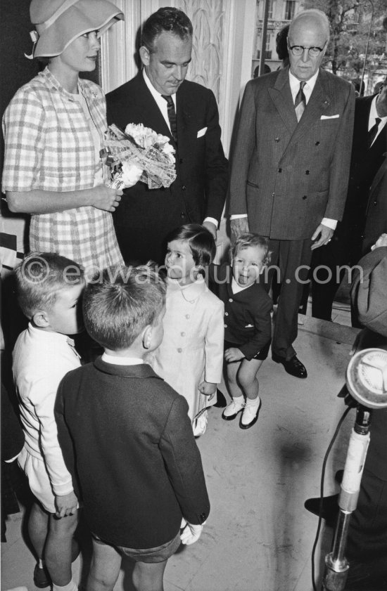 Prince Rainier of Monaco (centre) with his wife Princess Grace of Monaco and their children Prince Albert and Princess Caroline (centre below) and Prince Pierre (right) at the inauguration of the Bibliothèque Princess Caroline, Monaco 1960. (Grace Kelly) - Photo by Edward Quinn