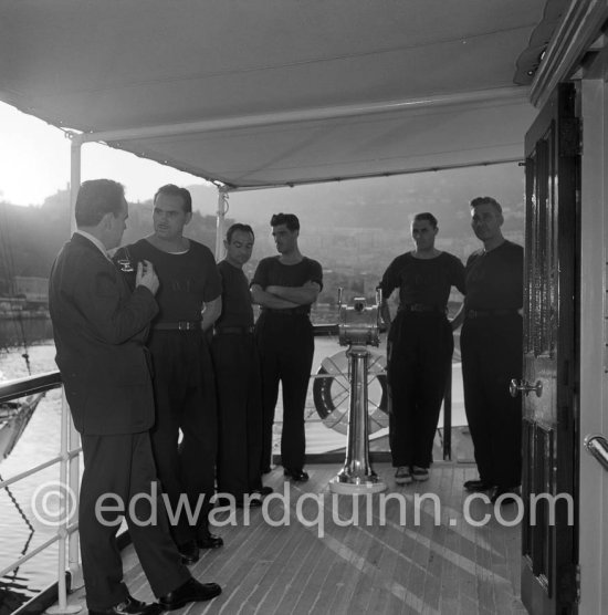 Prince Rainier with the crew of his yacht “Deo Juvante II” anchored at Monaco harbour 1953 - Photo by Edward Quinn