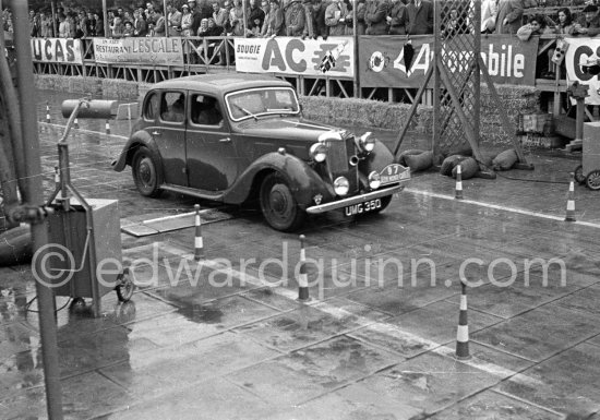 N° 97 Moore / Meisl on MG YA Saloon undergoing the breaking and starting test. Cars will have to accelerate as fast as possible for 200 metres from a standing start, and then pull up in the shortest possible distance, for the cars have to keep a line between the axles. Rallye Monte Carlo 1951. - Photo by Edward Quinn