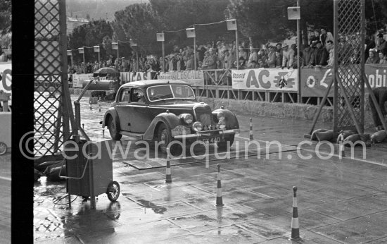 N° 224 Kevill-Davies / Pelling on Riley undergoing the breaking and starting test. Cars will have to accelerate as fast as possible for 200 metres from a standing start, and then pull up in the shortest possible distance, for the cars have to keep a line between the axles. Rallye Monte Carlo 1951. - Photo by Edward Quinn