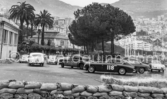 Faulkner/Silverthorne, Aston Martin DB2-4 N° 118, Appleyard/Appleyard on Jaguar Mk VII N° 90, Vard/Jolley on Jaguar MK VII N° 112 and 3 Porsche 356 taking part in the regularity speed test on the circuit of the Monaco Grand Prix. - Photo by Edward Quinn