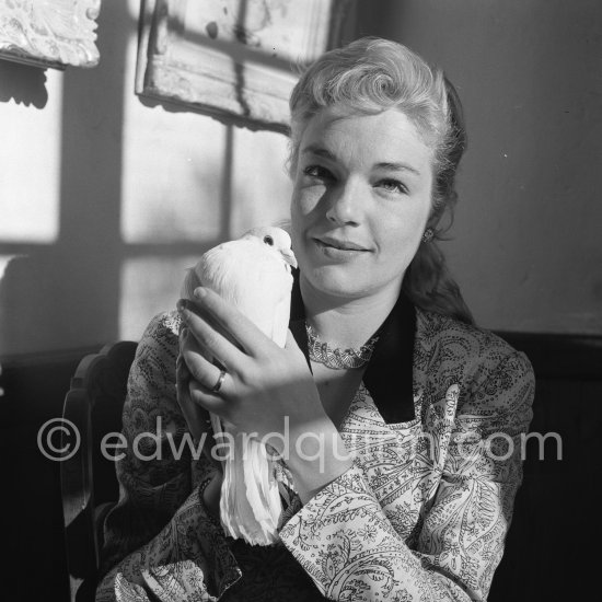Simone Signoret, French actress often hailed as one of France’s greatest movie stars, on her wedding in 1951 to actor and singer Yves Montand. At the same restaurant Colombe d’Or, Saint-Paul-de-Vence, where their romance began. Special guest – a dove. - Photo by Edward Quinn