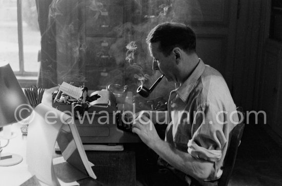 Georges Simenon at his desk. Villa Golden Gate, Cannes 1955. - Photo by Edward Quinn