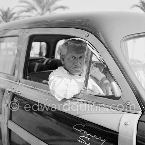 Spencer Tracy was considered an actors\' actor by his admiring colleagues. He came to Nice to sign for a film. Nice 1953. Cars: 1951 Ford Country Squire Woodie Wagon - Photo by Edward Quinn