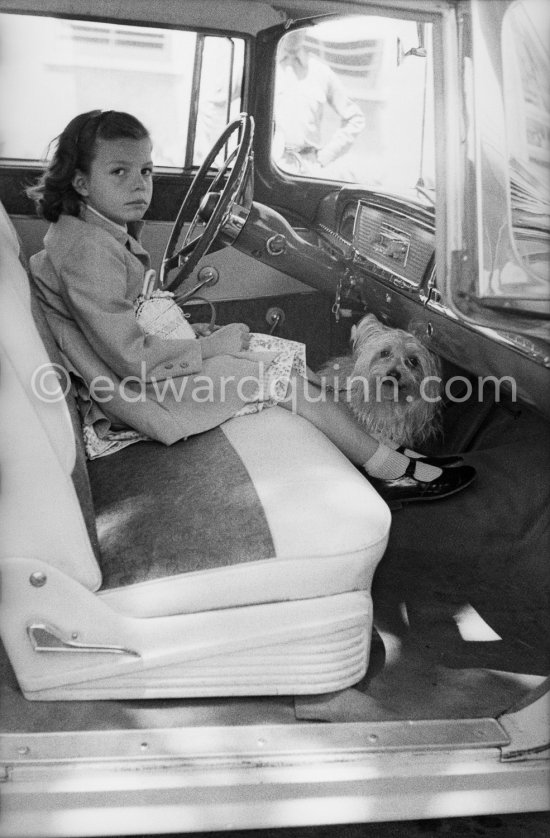 Rebecca Welles, daughter of Rita Hayworth and Orson Welles. Also traveling her faithful companion Harvey. Nice Airport 1956. Car: 1956. Nash Rambler Cross Country Custom - Photo by Edward Quinn