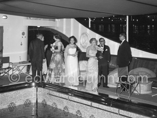 Cocktail on board the yacht Christina with Tina and Aristotle Onassis. Monaco harbor. August 1956. - Photo by Edward Quinn