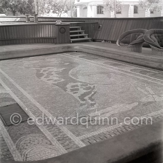 The mosaic swimming pool which drained and rose to deck level to create a dance floor on board Onassis\' yacht Christina. Monaco harbor 1955. - Photo by Edward Quinn