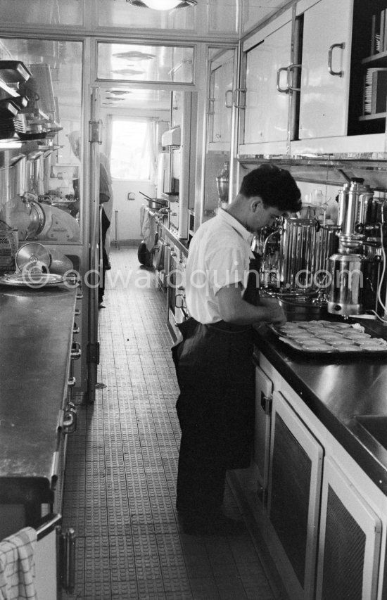 On board Onassis\' yacht Christina. in the kitchen. Monaco harbor 1955. - Photo by Edward Quinn