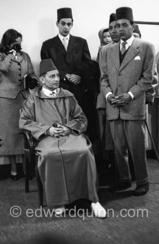 Sultan Mohammed ben Youssef at Nice airport waiting  for the motorcade that will take him to theGolf Hotel, Beauvallon. Nice 1955. - Photo by Edward Quinn