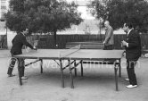 Charles Aznavour playing Ping Pong with singer Dario Moreno. Cannes 1960. - Photo by Edward Quinn