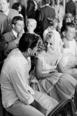Brigitte Bardot with Sacha Distel at the wedding of Jazz musician "Moustache". Behind them Noëlle Adam and Sidney Chaplin. Antibes 1958. - Photo by Edward Quinn