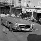 Yul Brynner and his wife were holidaying for a few days in a secret hide out in Saint-Tropez. However Brynner came out long enough to drive his new grey 1959 Mercedes-Benz 300 SL Roadster along the quayside and have a drink at one of the small restaurants. Saint-Tropez 1959. - Photo by Edward Quinn