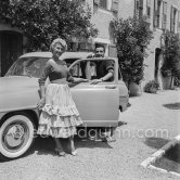 Martine Carol and Christian-Jaque (her husband, French writer-director) at their villa, the day of their wedding. Grasse 1954. Car: Simca Aronde Commerciale 1953. - Photo by Edward Quinn