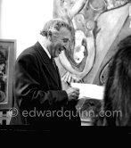 Marc Chagall signing autgraphs at the Chagall painting exhibition. Nice, February 1952. - Photo by Edward Quinn