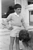 Charlie Chaplin's son Michael and Georges Simenon's poodle Mister. Cannes 1955 - Photo by Edward Quinn