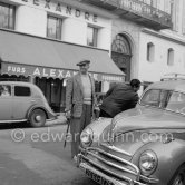 Maurice Chevalier with a stick as usual. Center of Nice 1951. Car: 1951 Ford Taunus de Luxe - Photo by Edward Quinn