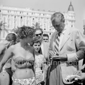 Gary Cooper with admirers, happy to get the star’s signature. Cannes 1953. - Photo by Edward Quinn