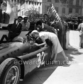 Driver Alberto Ascari and Bella Darvi during filming of "The Racers". Car: Lancia D50. Monaco 1955. - Photo by Edward Quinn