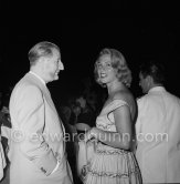 Jean-Gabriel Domergue and French actress Dora Doll. Reception at Palm Beach, MYCCA Motor Yacht Club of the Côte d’Azur, 1953. - Photo by Edward Quinn