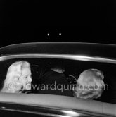 Two much photographed blondes, profile Diana Dors, back view Belinda Lee. Cannes Film Festival 1956. - Photo by Edward Quinn