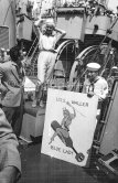 Diana Dors on U.S.S. Waller. On the left Tommy Yeardye, stuntman, her boyfriend. Cannes 1957. - Photo by Edward Quinn