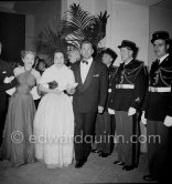 Kirk Douglas, Olivia de Havilland and Ann Baxter at a gala evening. Cannes Film Festival 1953. - Photo by Edward Quinn