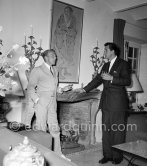 Rock Hudson at a cocktail party given by Jacques Fath (left) at his home "Moulin de Joko". Cannes 1954. - Photo by Edward Quinn