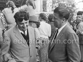 Federico Fellini in a conversation. Cannes Film Festival 1957. - Photo by Edward Quinn