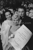 Giulietta Masina after winning the best actress award. Behind her are Maria Felix and Federico Fellini. Cannes 1957 - Photo by Edward Quinn