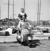 Mel Ferrer and Leslie Caron, French actress and dancer. She was one of the most famous musical stars in the 1950s. Cannes 1953. Scooter: 1952-53 Vespa ACMA 125 (made under license in France) - Photo by Edward Quinn