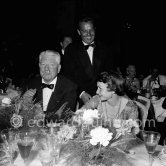 Jean Gabin and French actress Françoise Arnoul at a dinner at the Cannes Film Festival in 1955. - Photo by Edward Quinn