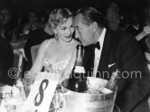 At table No. 8, Zsa Zsa Gabor and husband George Sanders. The attractive and witty film star got married several times. She loved to make headlines. In 1953 she came to the Cannes Film Festival with George Sanders. In 1955 they divorced. Cannes 1953. - Photo by Edward Quinn