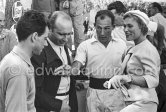 The Mercedes-Benz W196 drivers: André Simon, Juan Manuel Fangio and Stirling Moss with Bella Darvi, who had a leading role in the film "The Racers". Monaco Grand Prix 1955. - Photo by Edward Quinn