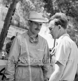 GP driver Graham Hill and not yet identified person. Monaco Grand Prix 1958. - Photo by Edward Quinn