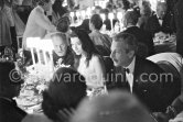 Darryl F. Zanuck, Juliette Gréco and Oleg Cassini, American fashion designer. Opening gala at Sporting d’Eté, Monte Carlo 1958. - Photo by Edward Quinn
