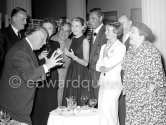 Alfred Hitchcock during a cocktail party given for the film "To Catch A Thief". Among the happily captive audience are (from left) John Williams, Jessie Royce Landis (behind Hitchcock), Charles Vanel, Grace Kelly, Cary Grant, Brigitte Auber, Georgette Anys. Cannes 1954. - Photo by Edward Quinn