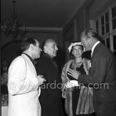 Charles Boyer, Georges Simenon, Curd Jürgens and Eva Bartok. Cannes Film Festival 1957. - Photo by Edward Quinn