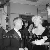 Jayne Mansfield at the Cannes Film Festival with André Bourvil, French comedian. Cannes 1958. - Photo by Edward Quinn