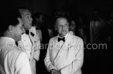 Somerset Maugham and his secretary and companion Alan Searle (left) and Noel Coward at the UN Refugees children charity gala at the Sporting d’Eté, Monte Carlo 1954. - Photo by Edward Quinn